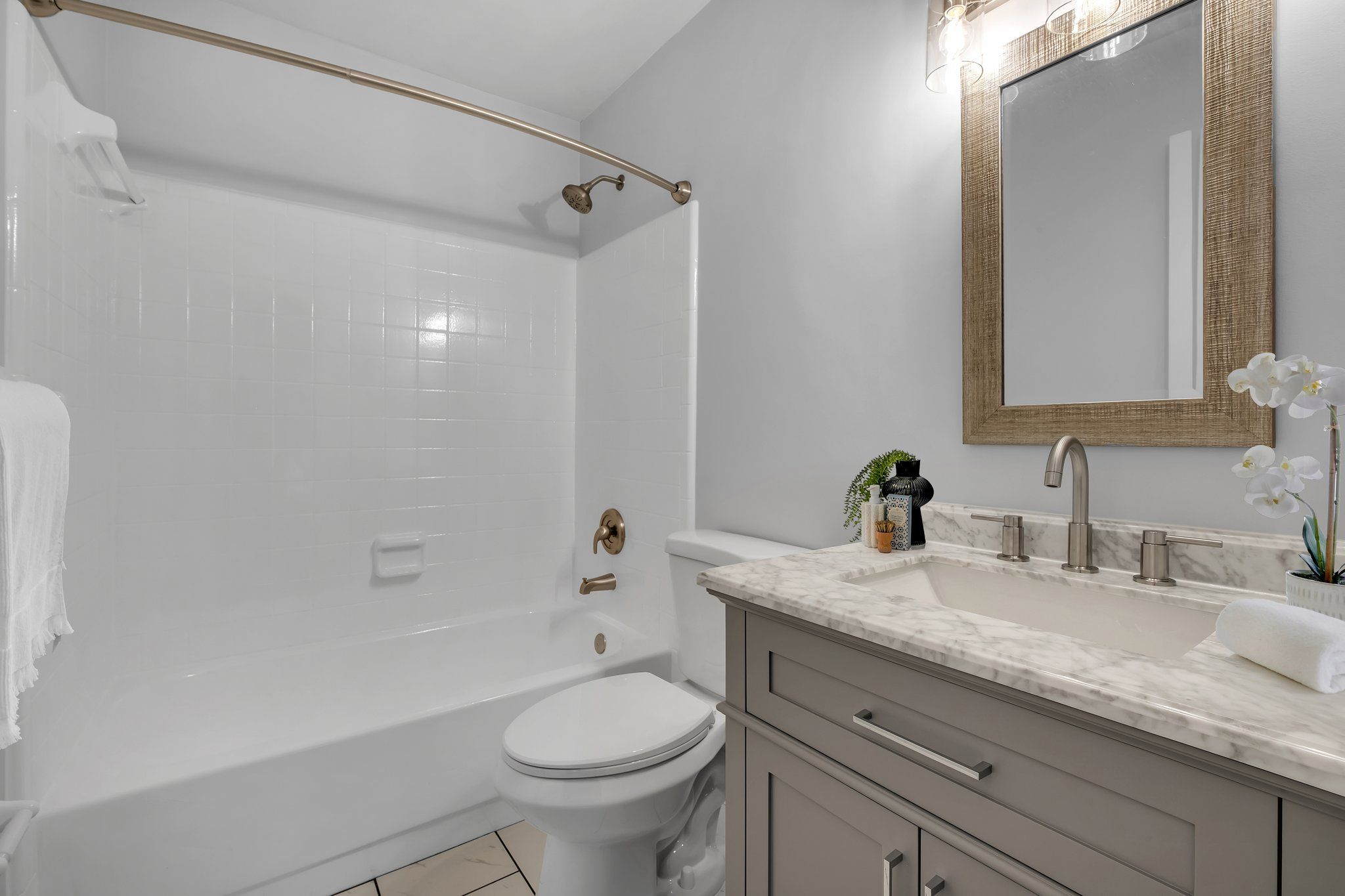 Primary bathroom with a clean tiled vanity